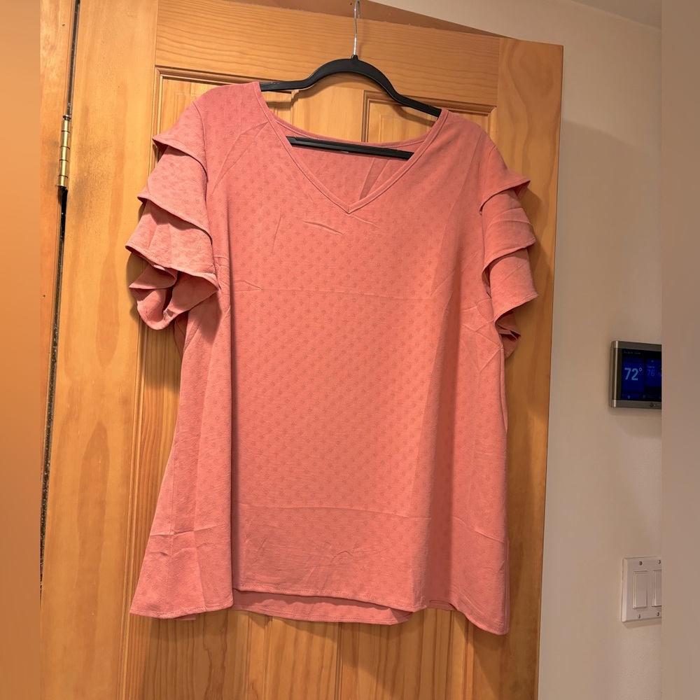 Coral/Peach color blouse with short ruffle sleeves in XXL size new never worn